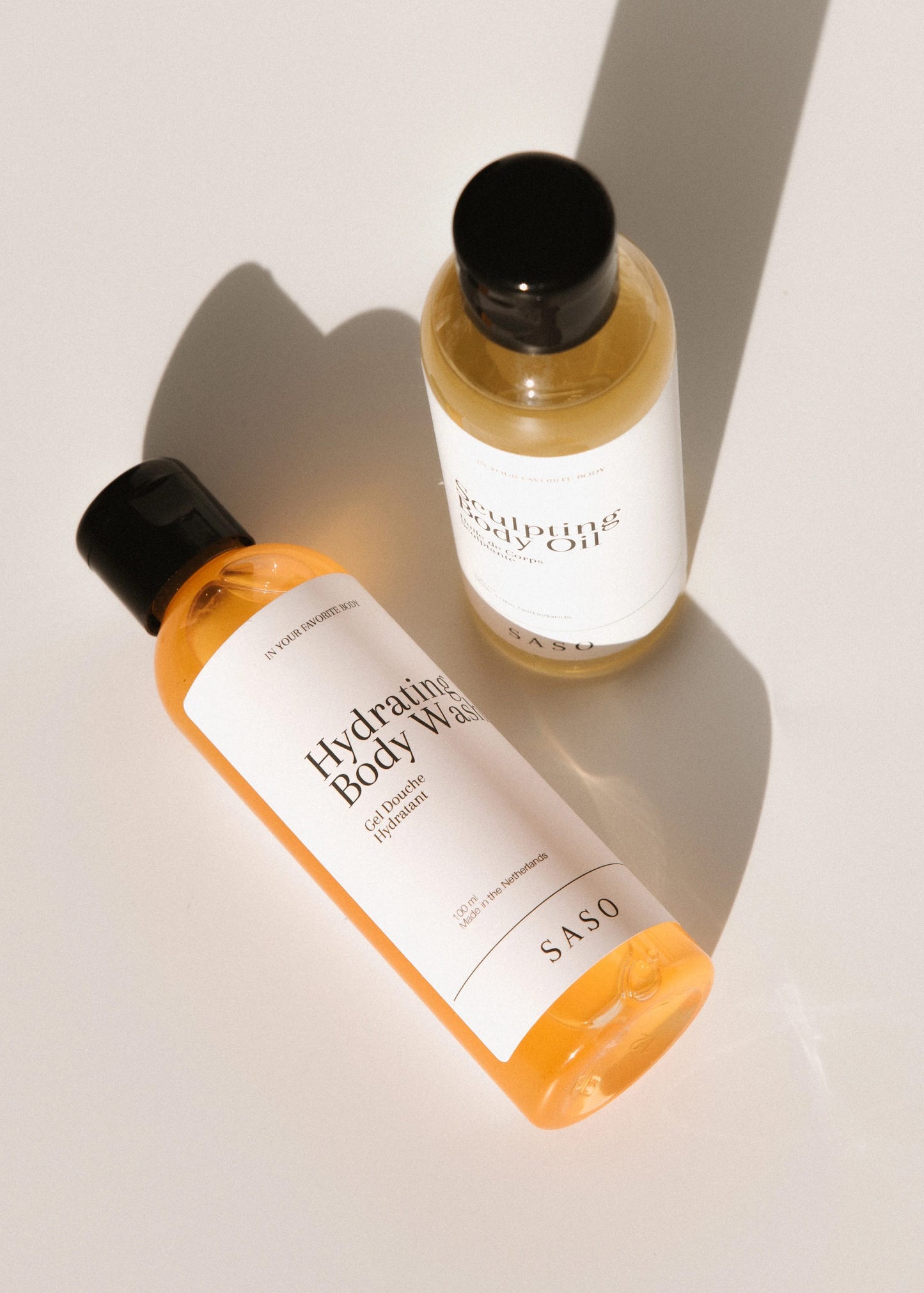 SASO body wash and oil; on neutral background.